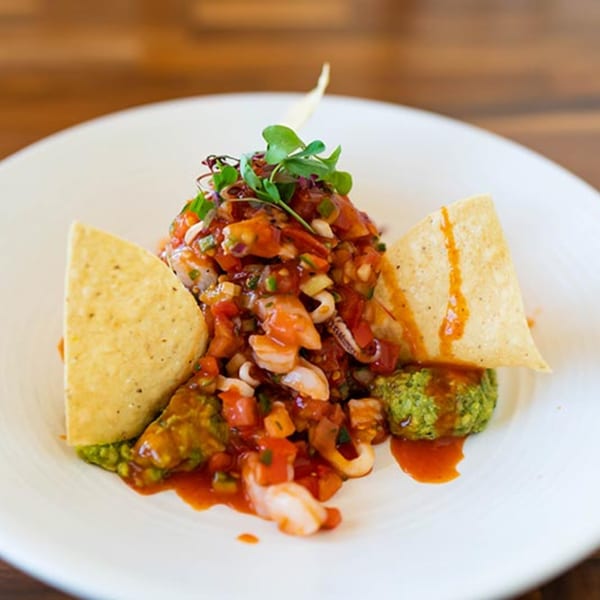Prados Modern Mexican Cantina's ceviche with shrimp, calamari, salsa, guacamole, and tortilla chips.