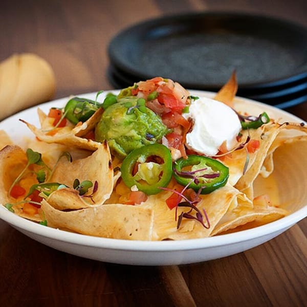 Prados Modern Mexican Cantina nachos with guacamole, sour cream, jalapeños, and pico de gallo.