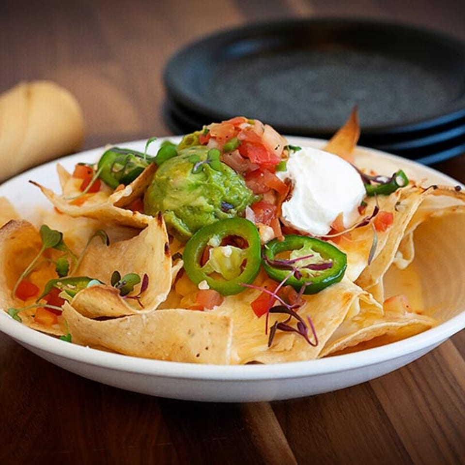 Prados Modern Mexican Cantina nachos with guacamole, sour cream, jalapeños, and pico de gallo.