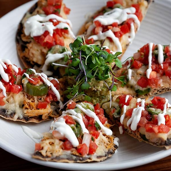Prados Modern Mexican Cantina's chicken nachos with pico de gallo, sour cream, and guacamole.
